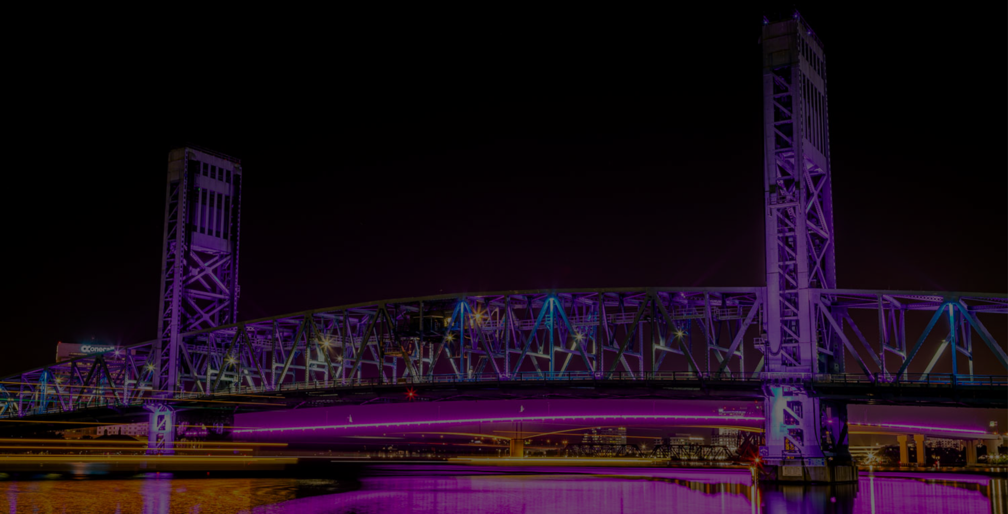 Main Street Bridge at night decorated in neon lights in Jacksonville, FL